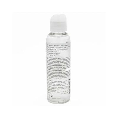 Clear 4 oz. bottle of Adam & Eve water-based lubricant with white flip-top cap and product information label.