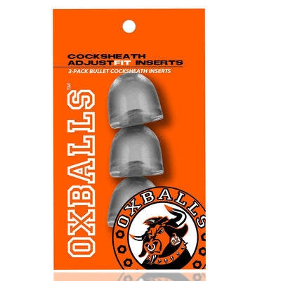Clear bullet-shaped cocksheath inserts in a pack of three on bright orange OXBALLS branded packaging.