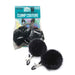 Black adjustable nipple clamps with soft rubber tips and fluffy black puff ball accents in retail packaging.