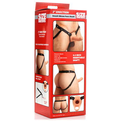 Packaging box of a 2 inch smooth silicone penis sheath with adjustable black harness shown on a model from front and back angles.