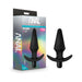 Black silicone vibrating anal plug with tapered shape and flared base next to its colorful retail packaging.