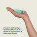 Hand holding a mint green Arcwave Ghost textured silicone stroker showcasing its flexible, ridged design.