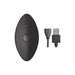 Black oval remote control with power button and red indicator light next to a USB charging cable on white background