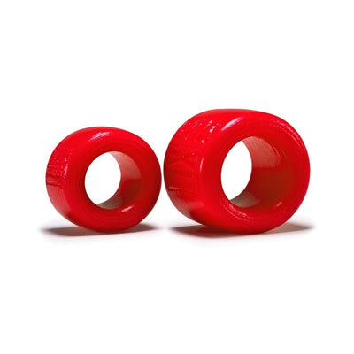 Two red silicone ballstretchers in small and medium sizes, displayed on a white background.