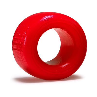 Small red silicone ballstretcher ring with smooth finish and rounded edges.