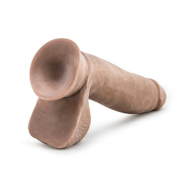 Realistic 7-inch flesh-toned dildo with flexible spine and soft, lifelike texture on white background.