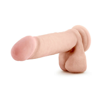 Realistic 8-inch dual density dildo with flexible spine and lifelike texture in natural skin tone.