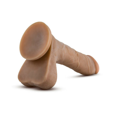 Realistic skin-toned flexible adult toy with suction base and detailed texture on white background.