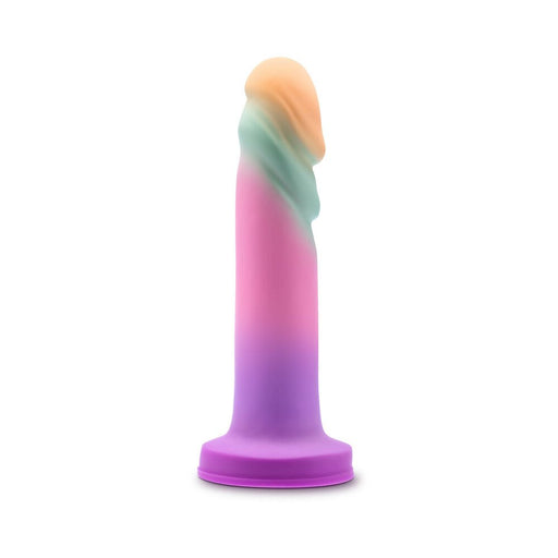 Pastel sherbet-colored artisanal dildo with textured ridges and suction cup base for hands-free use.
