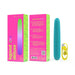 Teal sleek vibrator with yellow USB charging cable next to bright pink and green Bgood Deluxe packaging.