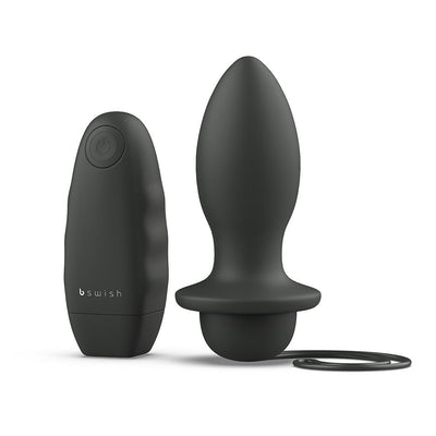 Black tapered silicone plug with broad base and attached pull-string, shown with matching ergonomic wireless remote control.