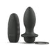 Black tapered silicone plug with broad base and attached pull-string, shown with matching ergonomic wireless remote control.