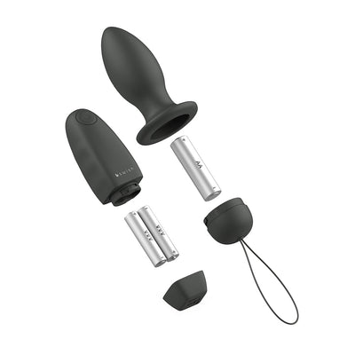 Black B Swish Bfilled Classic Unleashed plug with wireless remote and AA batteries shown disassembled on white background.