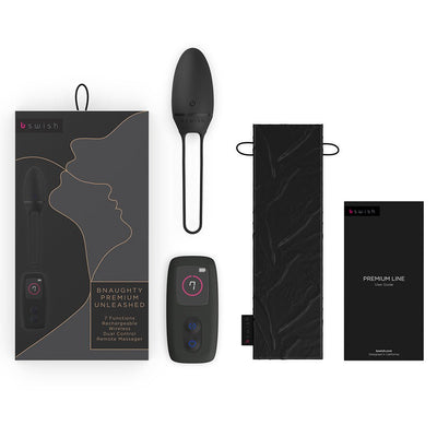 B Swish Bnaughty Premium Unleashed bullet massager with wireless remote, storage pouch, user guide, and packaging in dusk color.
