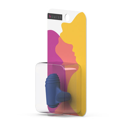 Compact blue B Swish Bteased Basic finger massager in clear plastic packaging with colorful abstract background.