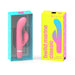 Pink B Swish Bwild Classic Marine dual motor vibrator in clear blue packaging next to its yellow and pink box.