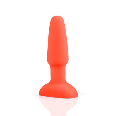Bright orange silicone B-Vibe Rimming Plug 2 with a tapered tip and flared base on a white background.