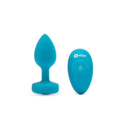 Blue b-Vibe vibrating jewel plug with matching remote control on white background.