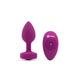 Purple silicone vibrating jewel plug with matching remote control, sleek and compact design.