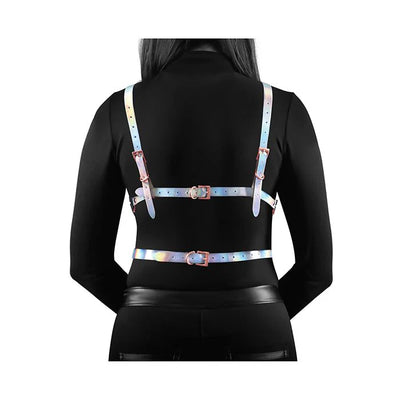 Back view of a person wearing a rainbow-colored adjustable chest harness with rose gold buckles over a black long-sleeve top.