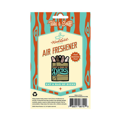 Packaging of Wood Rocket brand "Eat A Bag Of Dicks" air freshener with fresh banana scent, featuring playful retro design.