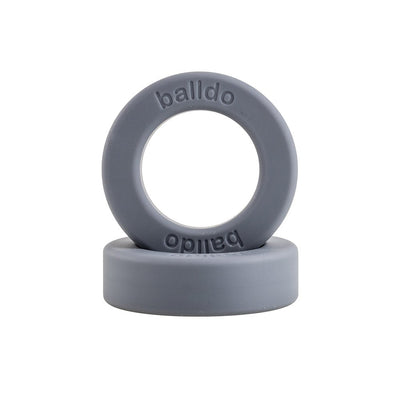 Steel grey Balldo spacer rings stacked, featuring embossed brand name on smooth silicone surface.
