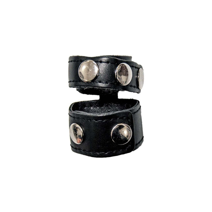 Black adjustable leather cock strap with metal studs and ball stretcher design.