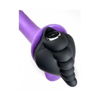Close-up of Banana Pants Honeybunch black silicone grind pad fitted with a bullet vibe on a purple base.