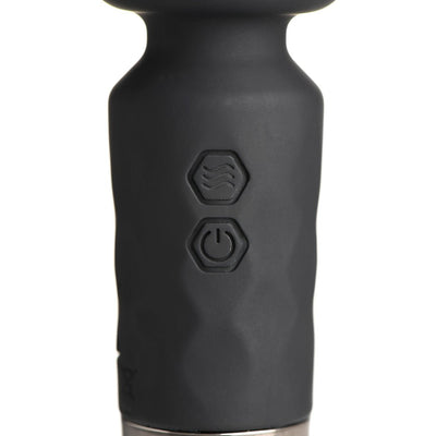Close-up of black silicone mini wand handle showing textured surface and two hexagonal control buttons.
