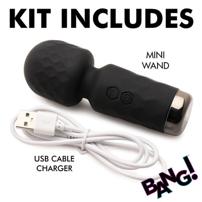 Black mini silicone wand with textured head and USB charging cable included in the kit on white background.