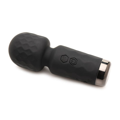 Compact black silicone mini wand vibrator with textured head and control buttons on handle, shown on white background.