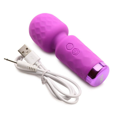 Compact purple silicone mini wand vibrator with textured head and USB charging cable on white background.