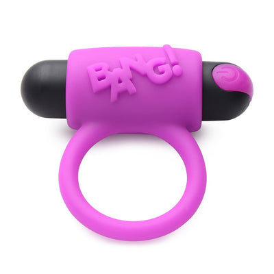 Purple silicone vibrating cock ring with black bullet and raised "BANG!" text on top, designed for couples.