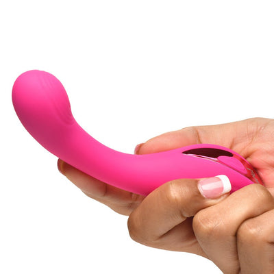 Hand holding a bright pink, curved G-spot vibrator with a rounded, textured head and control buttons on the handle.