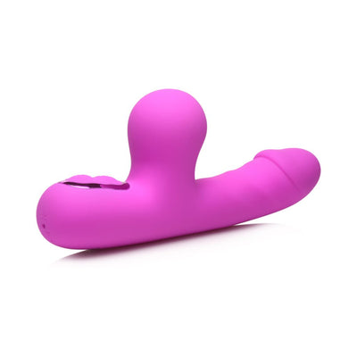 Pink silicone mini rabbit vibrator with curved clit suction arm and textured shaft on white background.