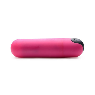 Pink compact vibrating bullet with black power button on white background