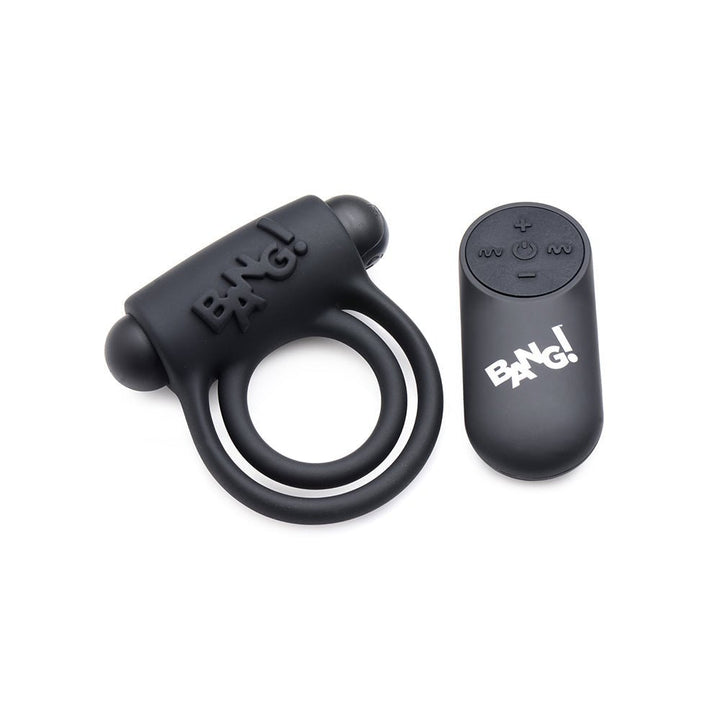 Black silicone vibrating cock ring with dual rings and bullet, paired with a compact remote control featuring multiple buttons.