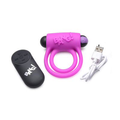 Purple silicone vibrating cock ring with black bullet, black remote control, and white USB charging cable on white background.