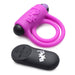 Purple silicone vibrating cock ring with dual rings and black bullet, accompanied by a black remote control with buttons.