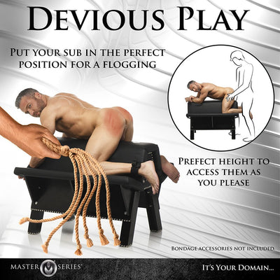 Black padded bondage bench with a man kneeling on it, restrained by cuffs, and a hand holding a flogger nearby.