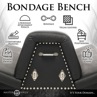 Black vegan leather bondage bench with metal studs, six attachment points, and padded cushions for comfortable, secure positioning.