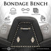 Black vegan leather bondage bench with metal studs, six attachment points, and padded cushions for comfortable, secure positioning.