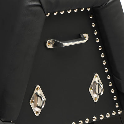 Close-up of black vegan leather bondage bench corner with silver metal studs, handles, and D-ring attachment points.