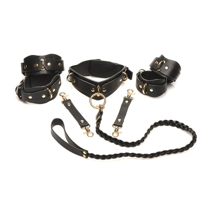 Black vegan leather lovers restraint set with adjustable wrist and ankle cuffs, collar with braided leash, and gold metal accents.