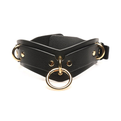 Black vegan leather collar with gold metal rings and adjustable buckle, part of a lovers restraints set.