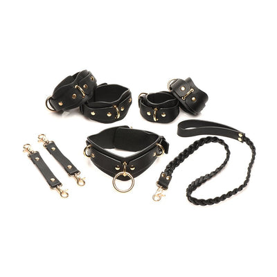 Black vegan leather lovers restraint set with adjustable wrist and ankle cuffs, collar with braided leash, and gold metal accents.