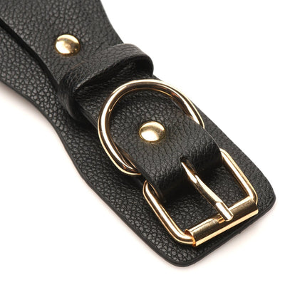 Close-up of black vegan leather strap with gold-tone buckle and D-ring detail from Bedroom Bliss Lovers Restraints Set.