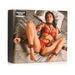 Bedroom Bliss Lovers Restraints Set packaging featuring a model in red lingerie wearing matching red vegan leather cuffs and collar on satin bedding.