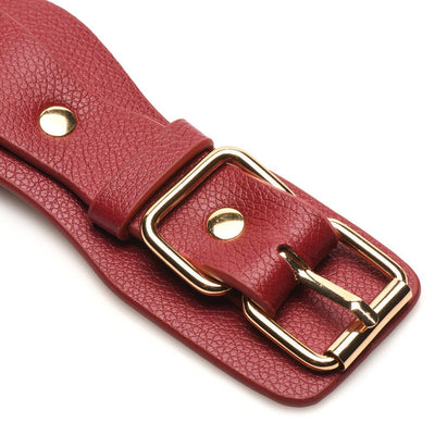 Close-up of red vegan leather strap with gold-tone buckle and rivet detail from Bedroom Bliss Lovers Restraints Set.