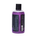 Purple bottle of Big Flirt Tropical Tease pheromone-infused bubble bath with black cap and detailed label on white background.